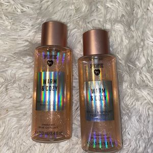 two bottles of warm & cozy shimmer body spray